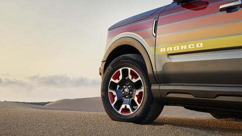 The SUV flaunts bright-colored decals inspired by the sunset