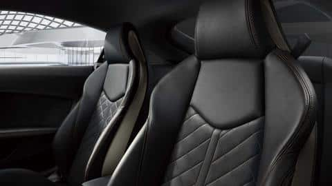 It features Nappa leather upholstery with contrasting bronze-colored stitching