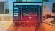 Sensex and Nifty close flat amid volatility