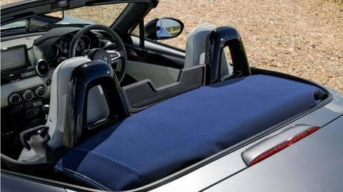 The car features a neatly-folding fabric roof