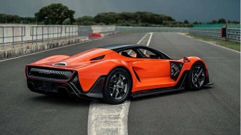 The hypercar features vertically-stacked headlights and a U-shaped taillamp