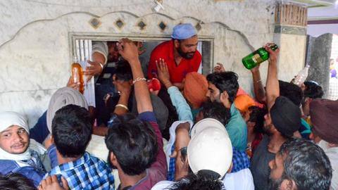 Thousands offer liquor at shrine, COVID-19 norms shredded to bits Thousands offer liquor at shrine, COVID-19 norms shredded to bits
