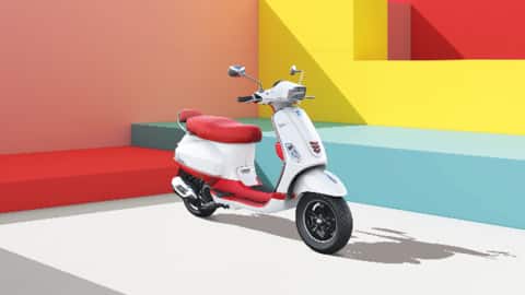 The scooter features a neo-retro design with dual-tone color schemes