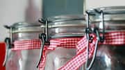 Turn empty glass jars into handy storage solutions