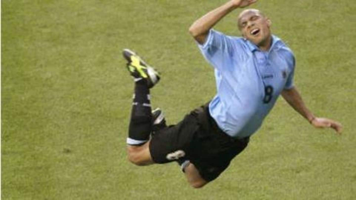  A Uruguayan soccer player is suspended in mid-air after scoring a goal against Brazil in the 2002 World Cup.