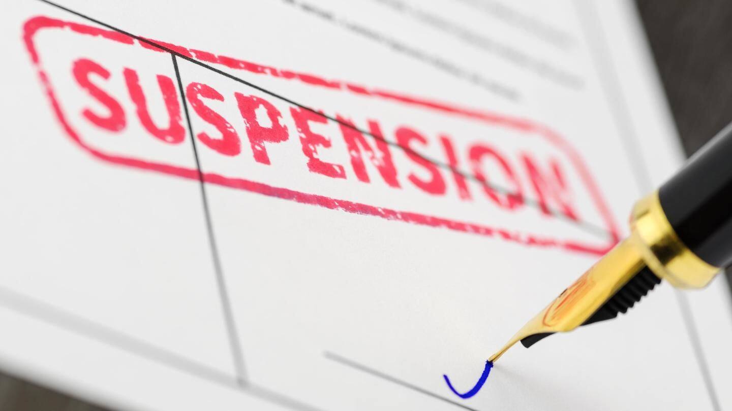 Amid pressure, government suspends six officials Amid pressure, government suspends six officials