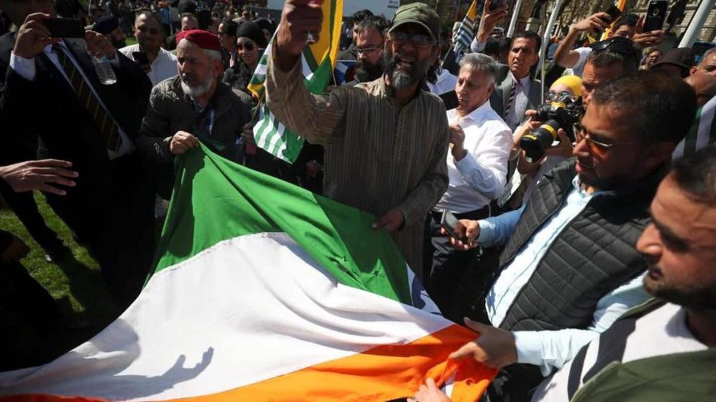 UK apologizes after protesters tear down Indian flag in London