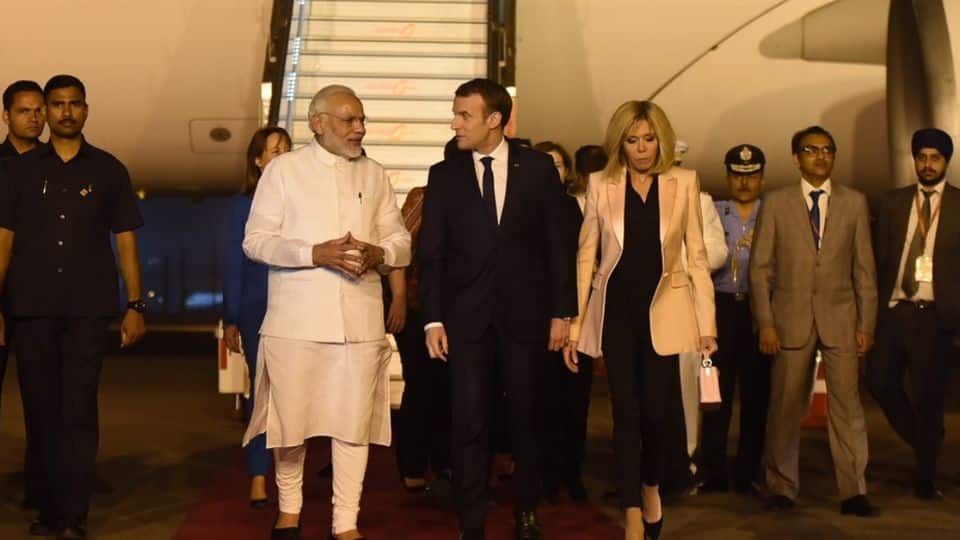 France's Emmanuel Macron arrives in India, gets Modi's hug
