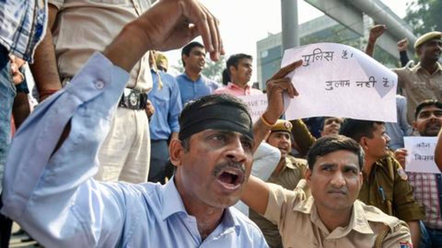 Wearing bands and carrying placards, officers protested at ITO Wearing bands and carrying placards, officers protested at ITO