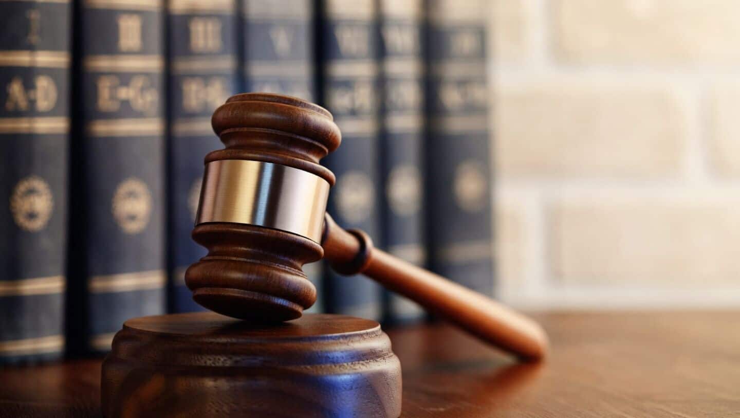 Supreme Court says criminal cases must end after loan settlements