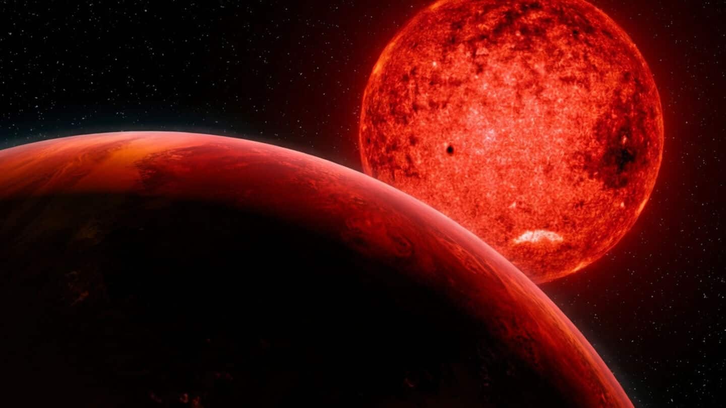 Giant exoplanet TOI 5205b defies formation rules around red dwarf