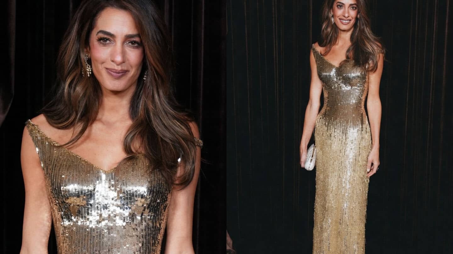 Clooney stuns in golden Gucci gown at Natural History Museum