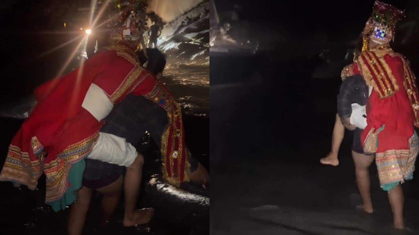 Local man carries groom across flooded stream at Chamba wedding