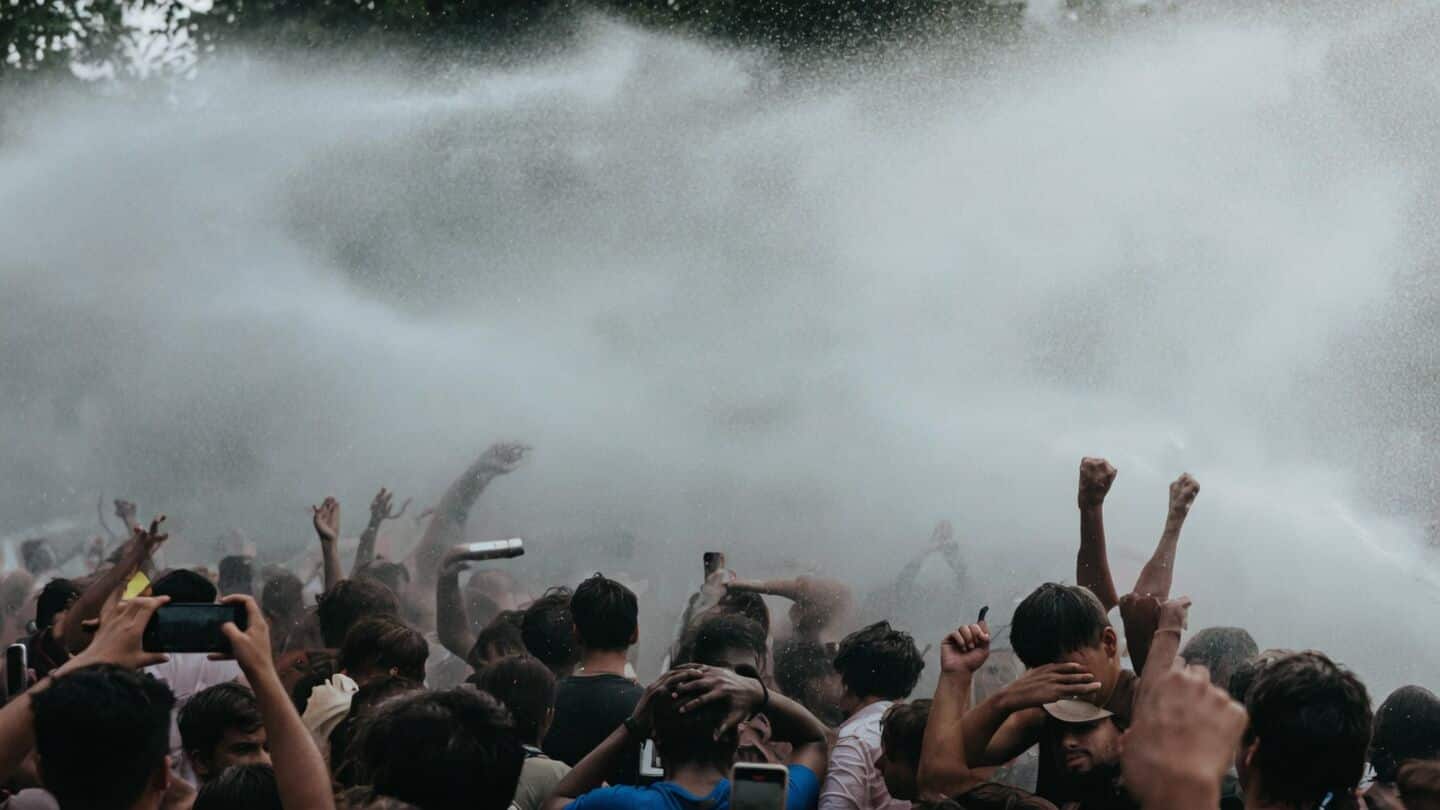 Students dance as police spray water at Patna NEET protest