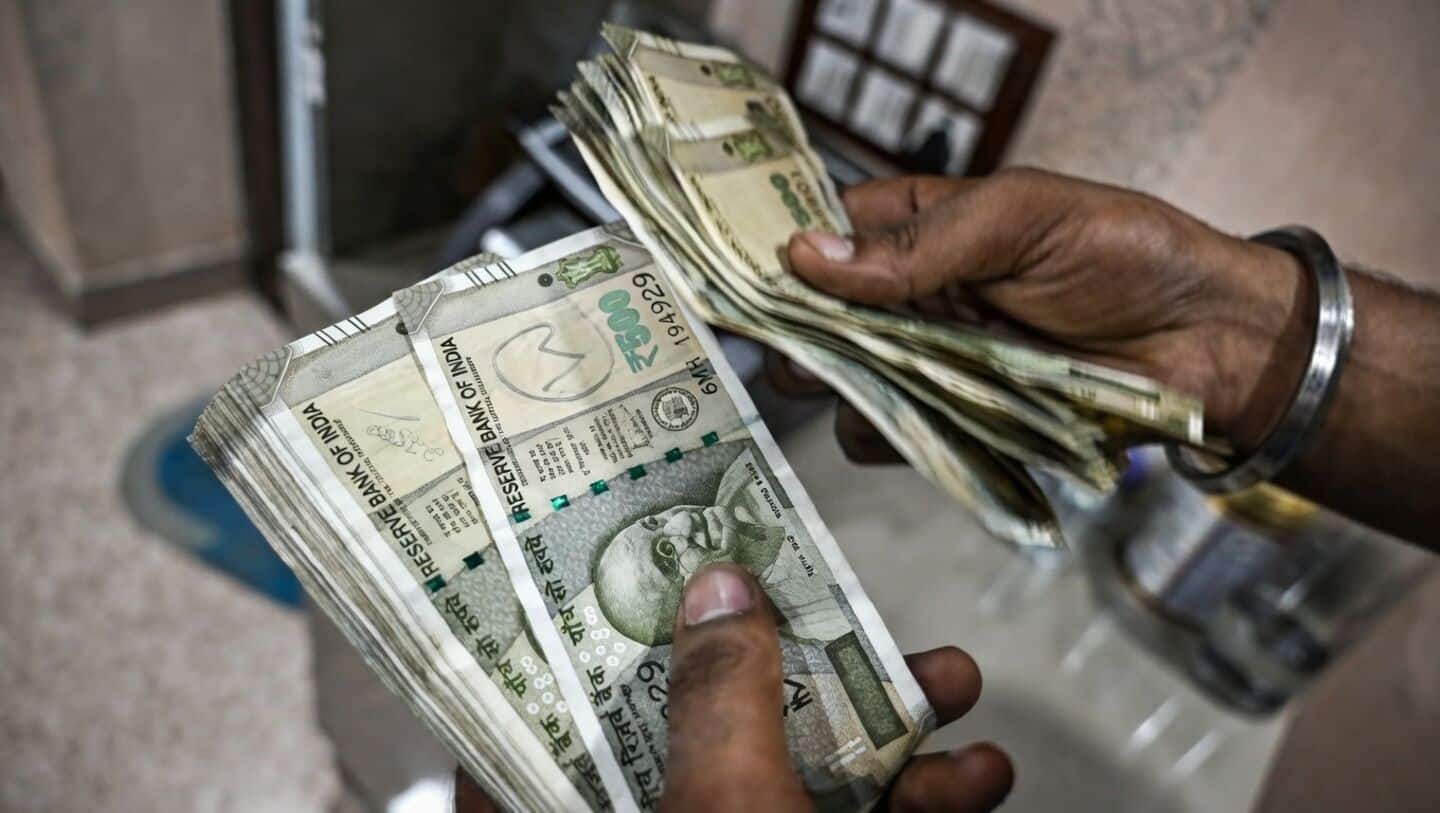 Indian rupee hits record 96 per US dollar on oil
