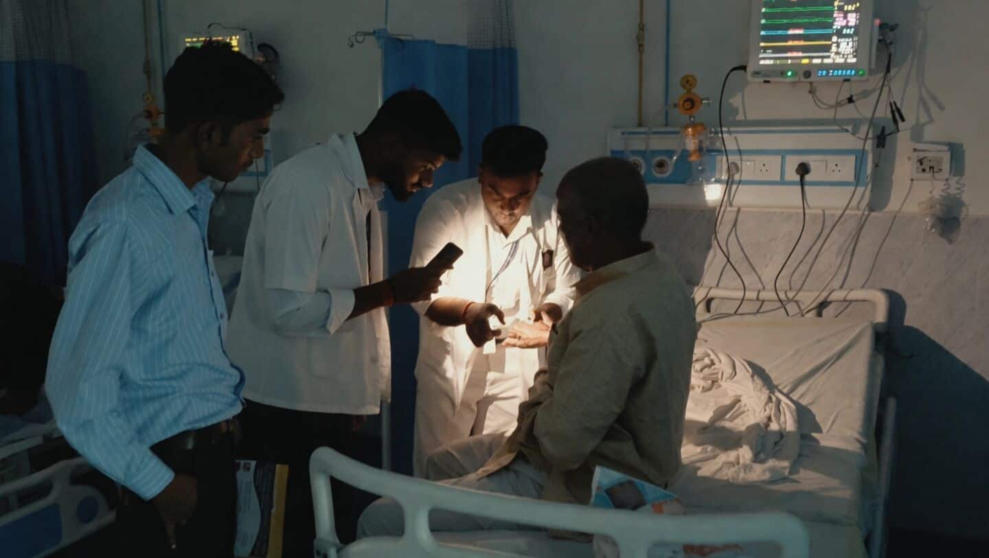 Doctors and nurses at Sasaram Sadar Hospital use phone torches