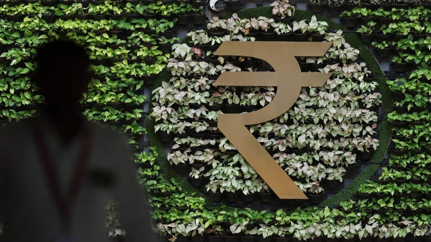 Rupee closes at 94.4850 per US dollar as RBI intervenes