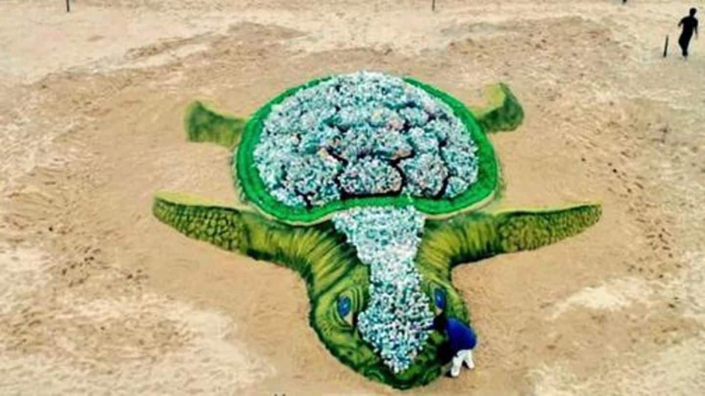 Sand artist creates big sand turtle on World Environment Day