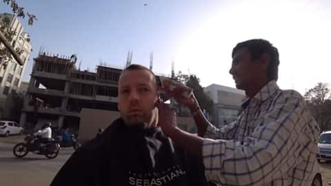 Norwegian pays Rs. 28,000 for street-haircut in Ahmedabad. Here's why