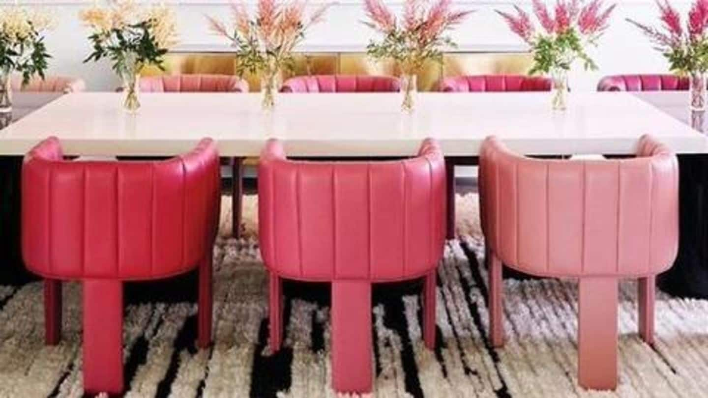 Dining table chairs are custom dyed with shades of pink