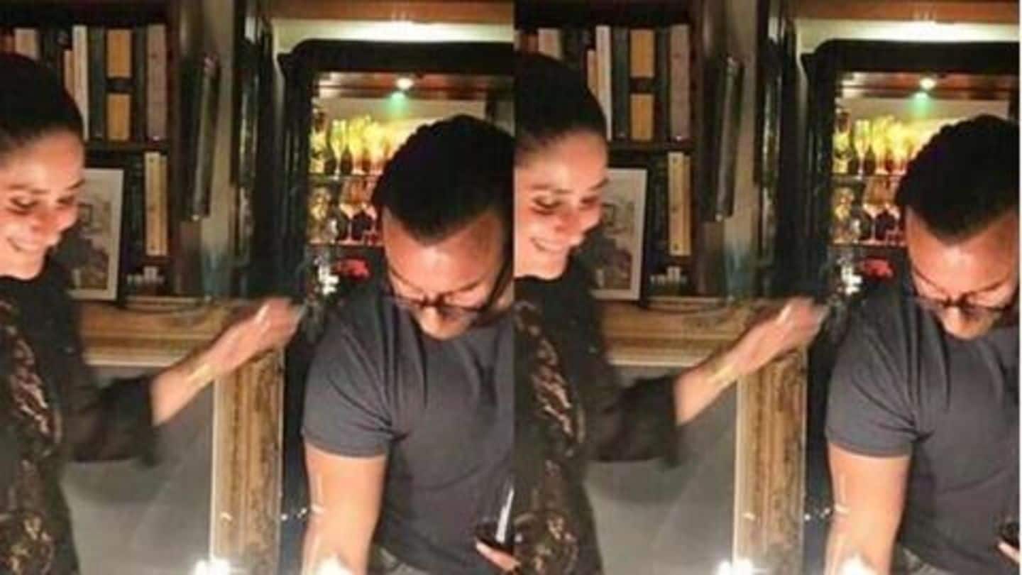 Saif cuts the cake with his lady by his side Saif cuts the cake with his lady by his side