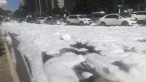 White foam covers entire street, changes China town into Iceland!