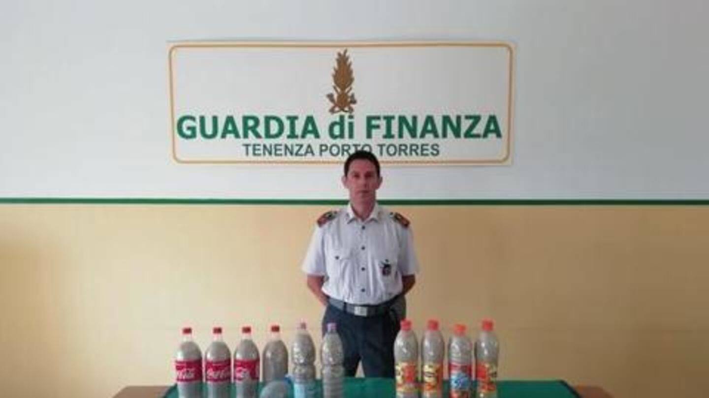 Couple filled 14 bottles with 90lbs of white sand Couple filled 14 bottles with 90lbs of white sand