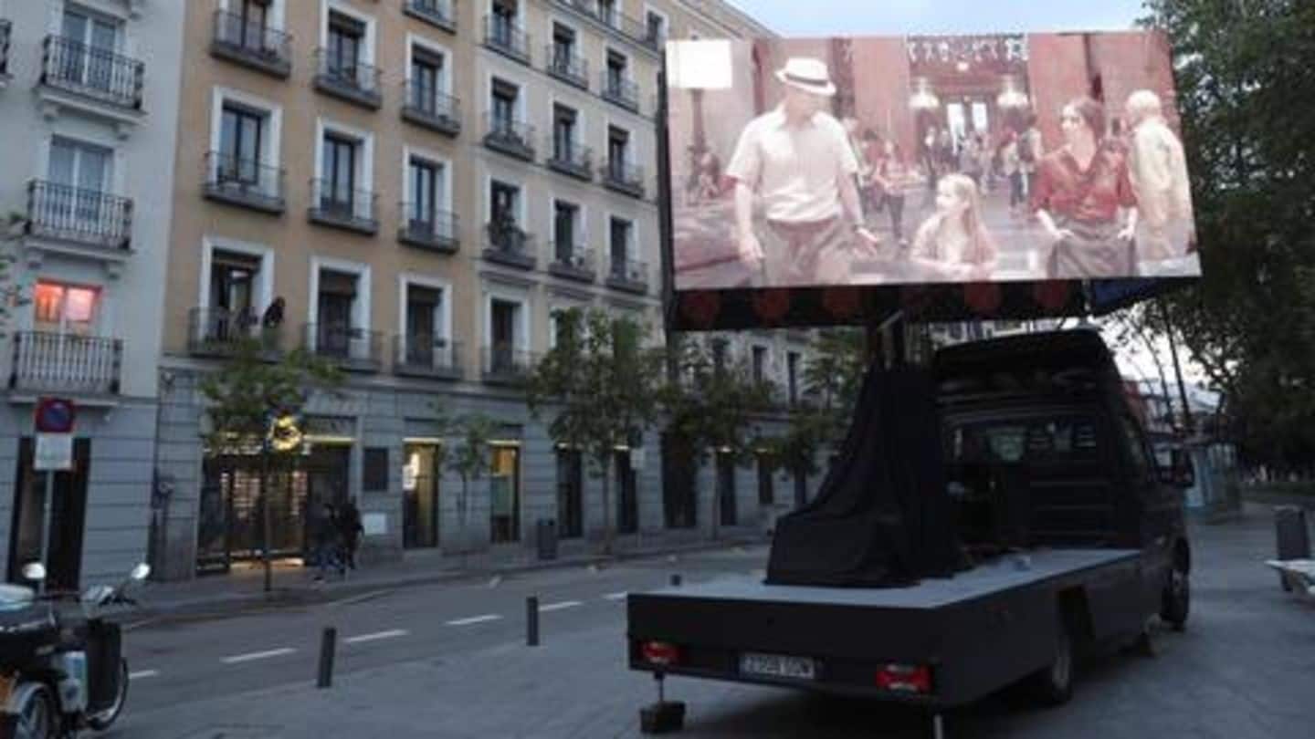 Under lockdown, Spaniards entertain themselves with 'balcony cinema' in Madrid