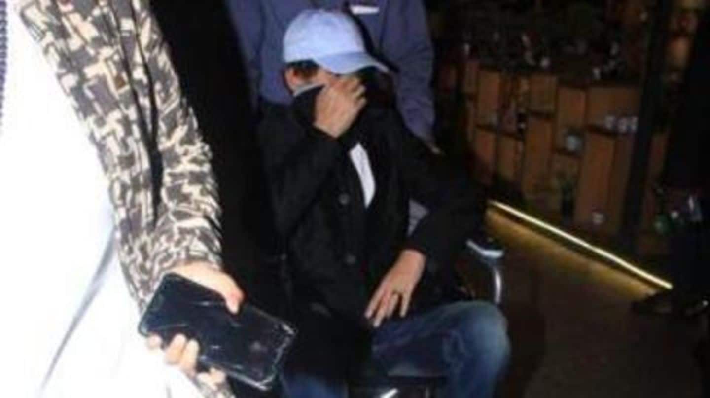 Khan hid his face from cameras at Mumbai airport Khan hid his face from cameras at Mumbai airport
