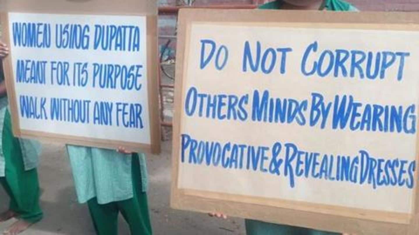 One placard reads 'Parents protect yourself, your children from Gays-Homos-Lesbians' One placard reads 'Parents protect yourself, your children from Gays-Homos-Lesbians'