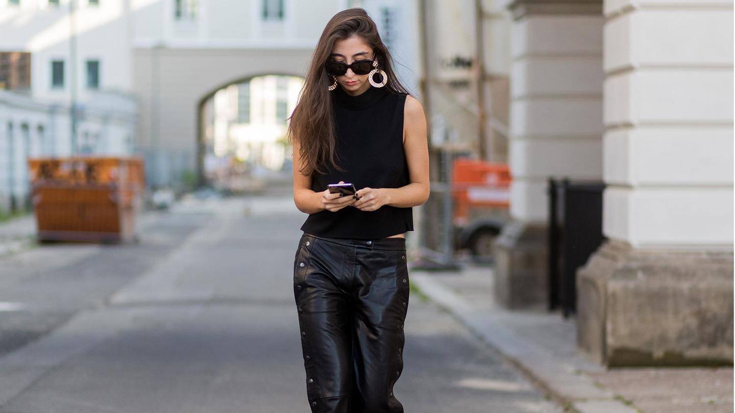 The all-black ensemble: Black tee, bottoms, shoes, and jacket The all-black ensemble: Black tee, bottoms, shoes, and jacket