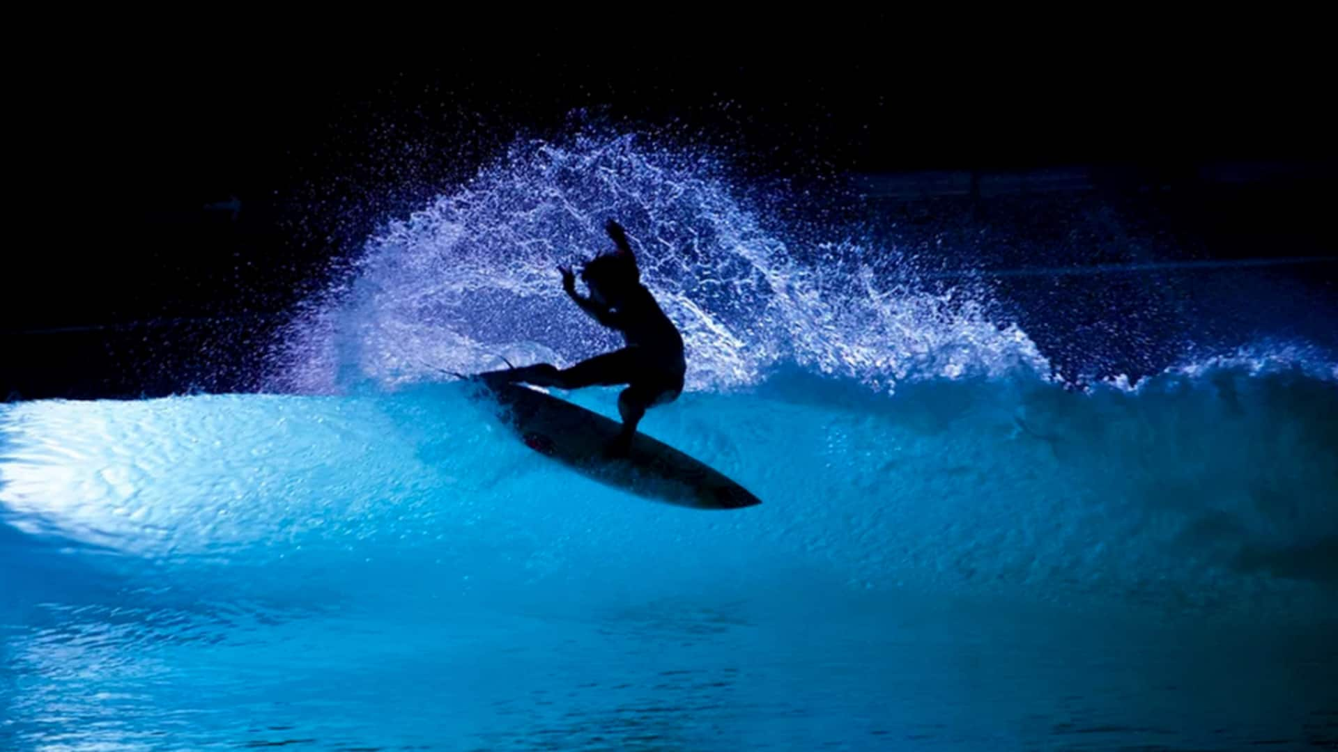 Pyrotechnic surfing shows: Fiery waves at night