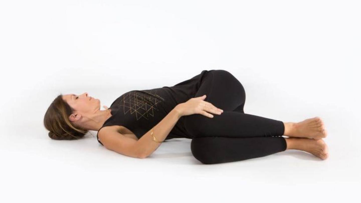 Supine Twist opens up tight shoulders, reduces stress Supine Twist opens up tight shoulders, reduces stress