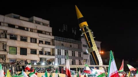 Iran holds rallies featuring ballistic missile launcher 