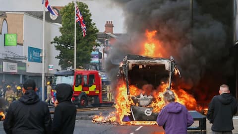 Vehicles, homes burned as anti-immigration violence flares in Northern Ireland 