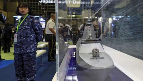 Japan scraps postwar arms export limits, opens global weapons market