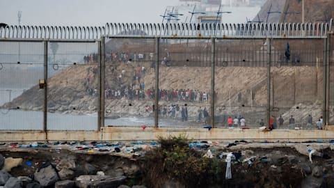 Spain begins installing floating barrier after massive migrant influx