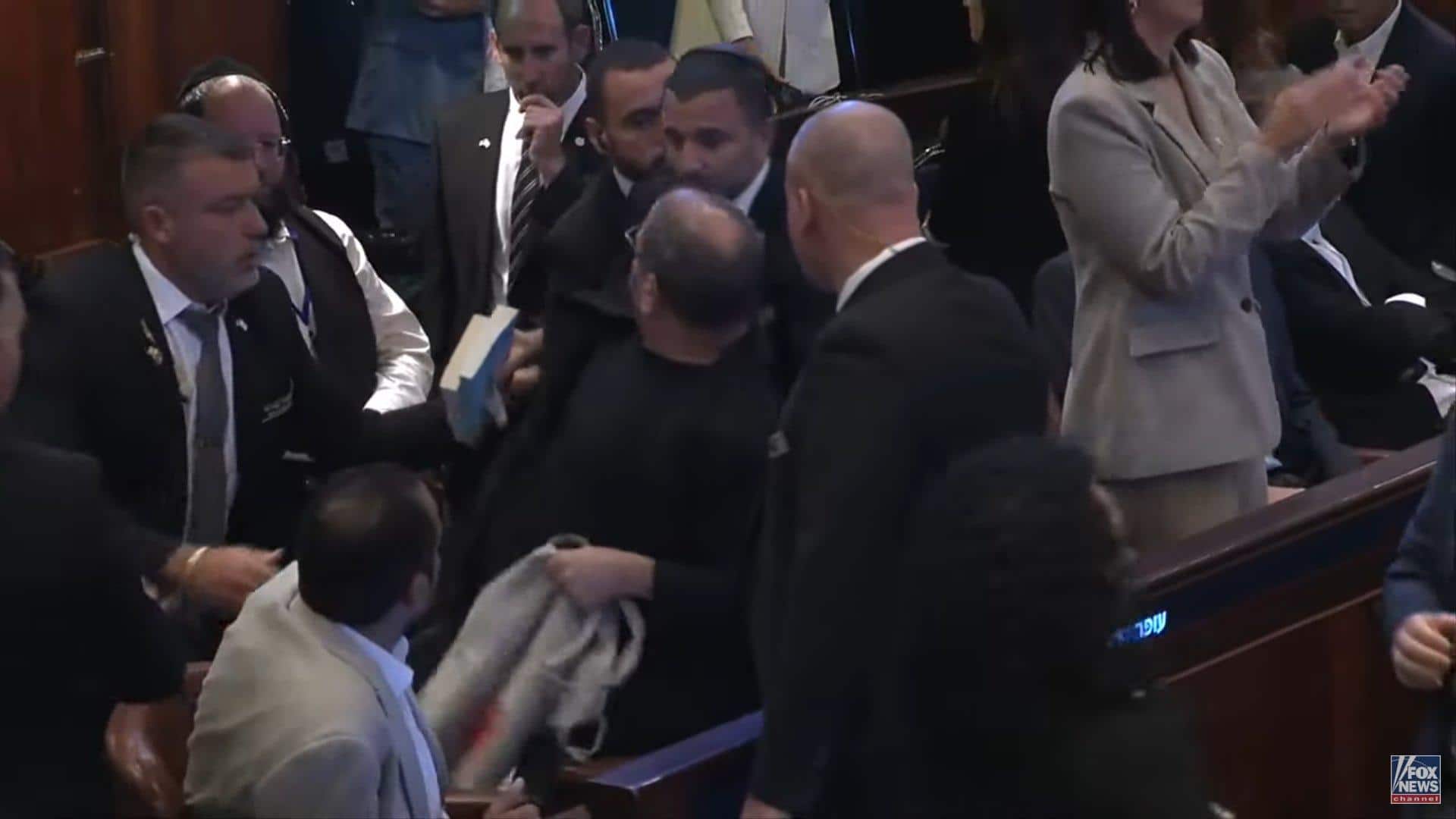 Video: Knesset members interrupt Trump's speech by unfurling 'genocide' banner