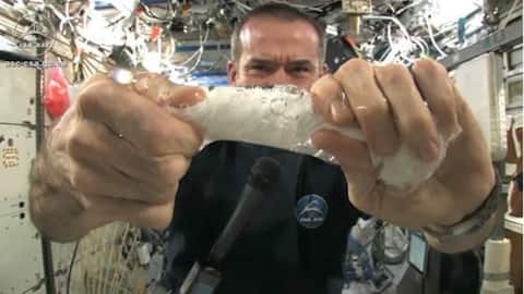 Wringing wet cloth in space: Astronaut demonstrates water's fascinating property