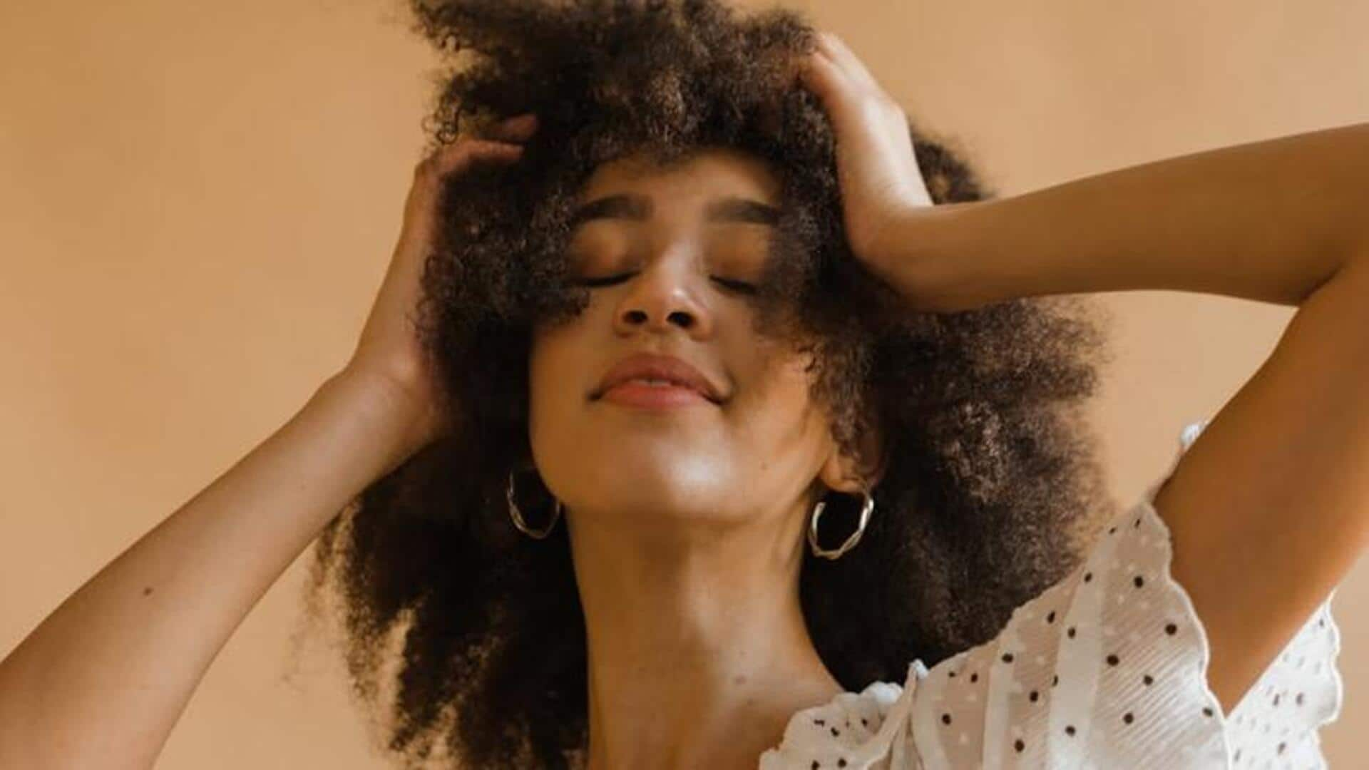 Gentle finger coiling for hydrated curly hair