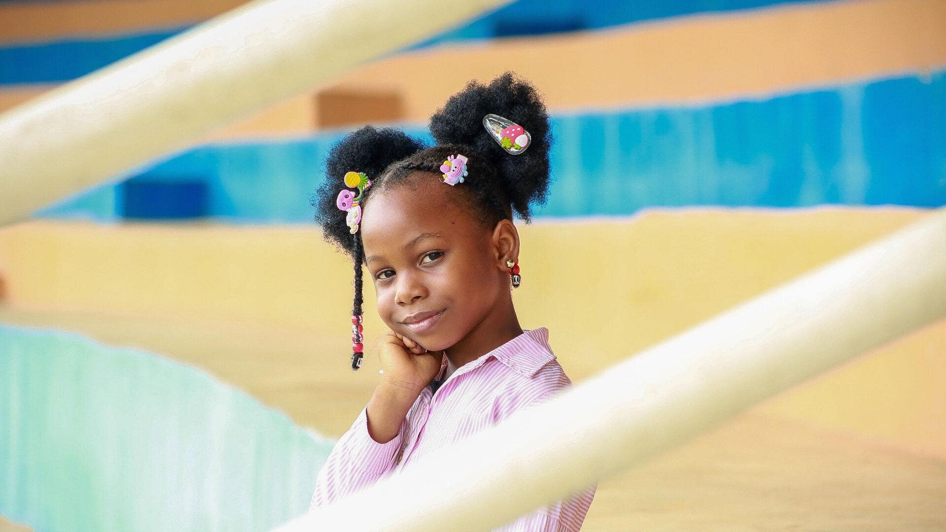 5 afro puff hairstyles to try this summer