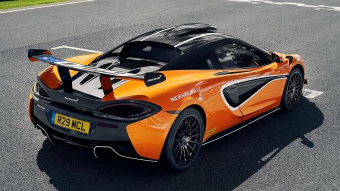The car has eye-shaped headlights and a large rear wing The car has eye-shaped headlights and a large rear wing