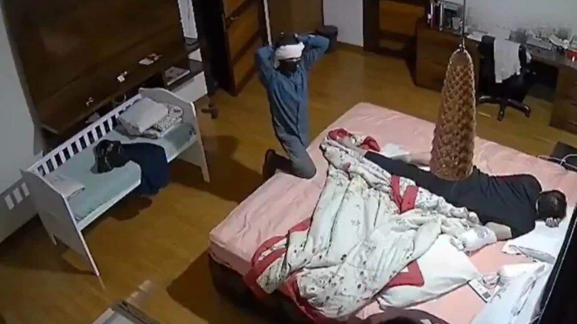 Video: Ex-judge's son sleeps on while robbers loot his room Video: Ex-judge's son sleeps on while robbers loot his room