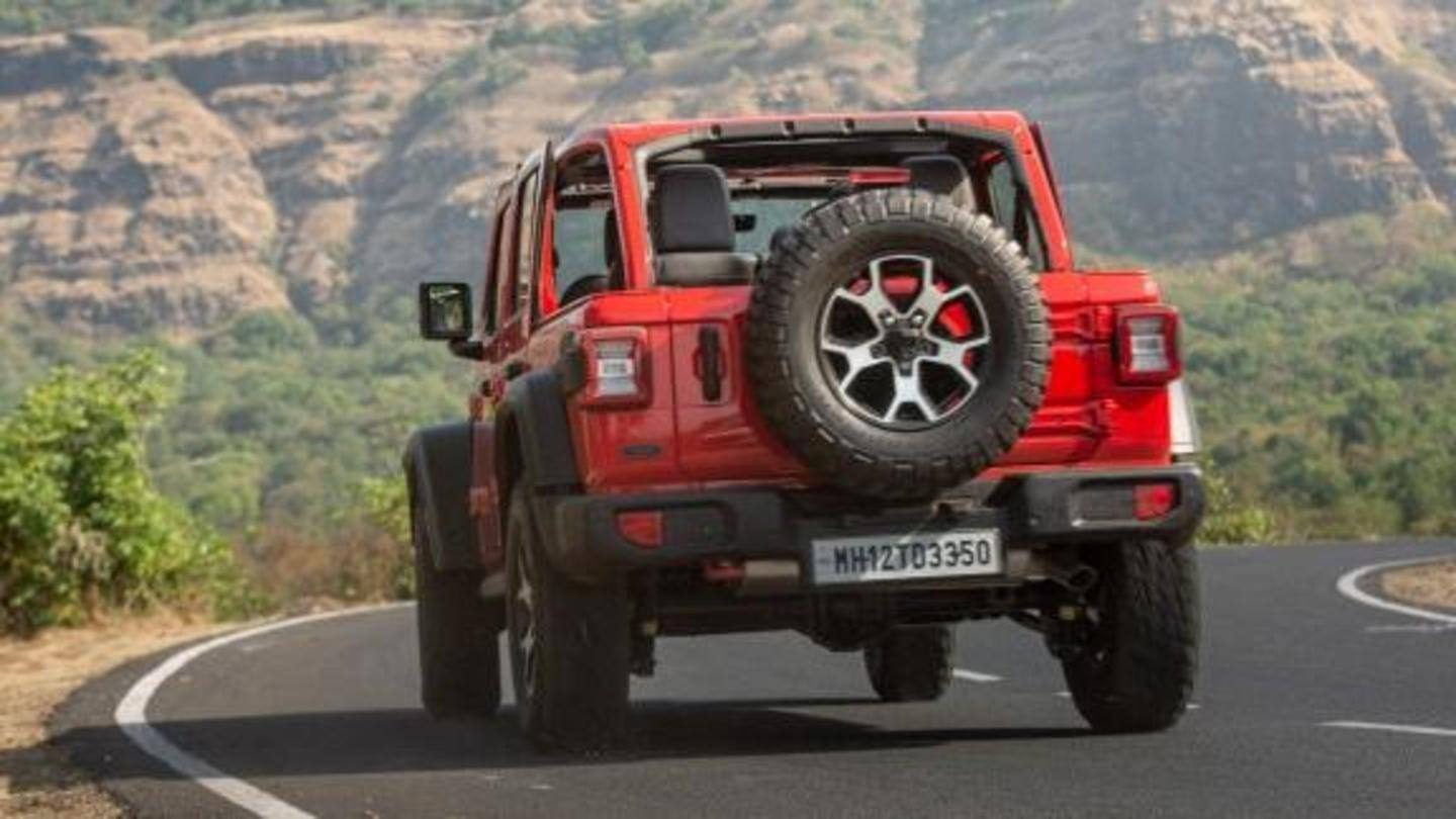 The car has round headlights and a tailgate-mounted spare wheel The car has round headlights and a tailgate-mounted spare wheel