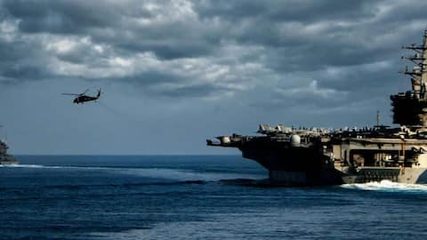 Trump says navy may escort tankers through Strait of Hormuz 