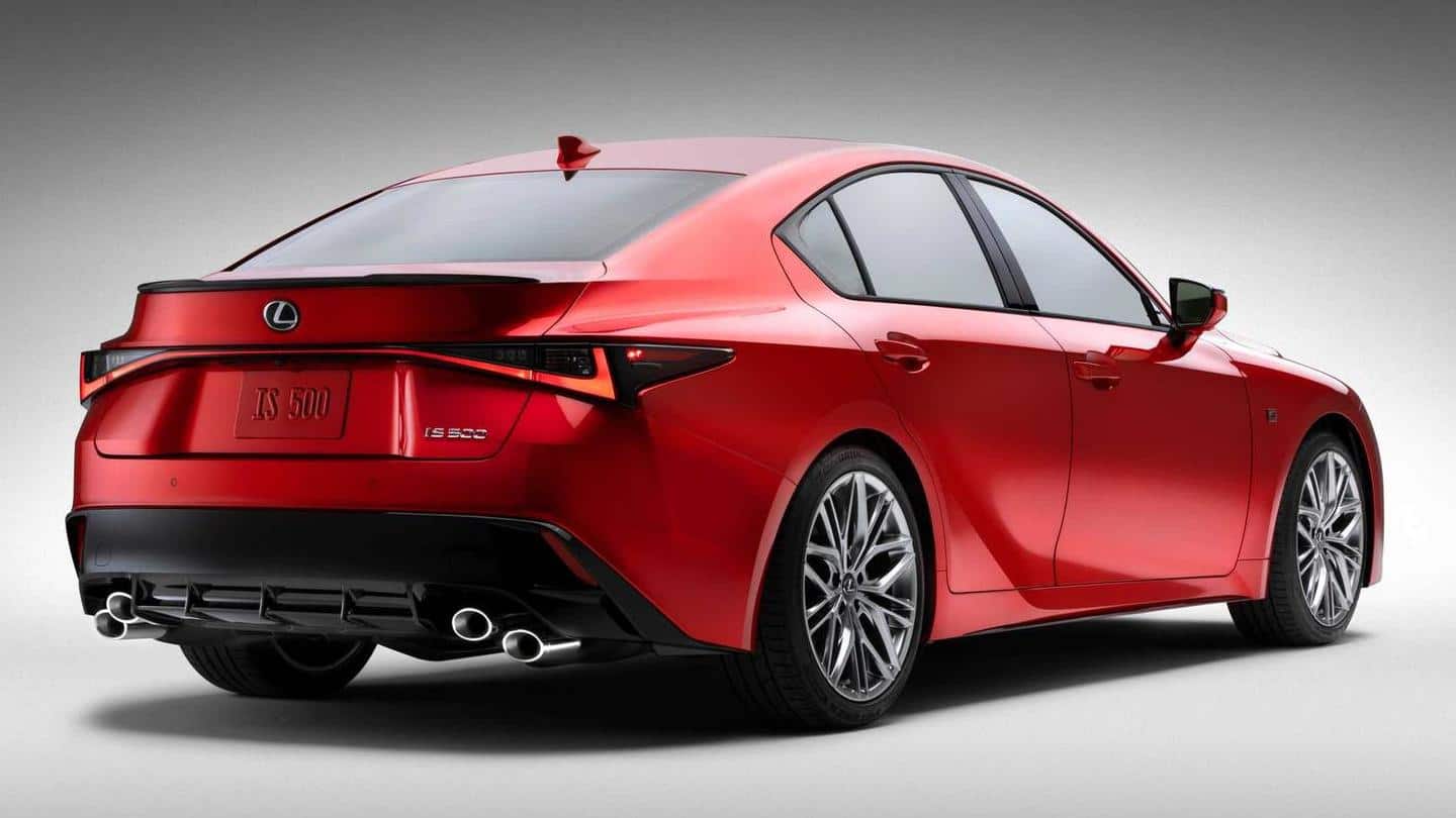 The car sports a large blacked-out grille and sleek headlights The car sports a large blacked-out grille and sleek headlights
