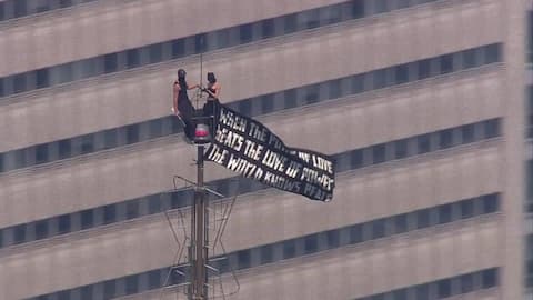 Russian couple arrested after daring Empire State marriage proposal stunt 