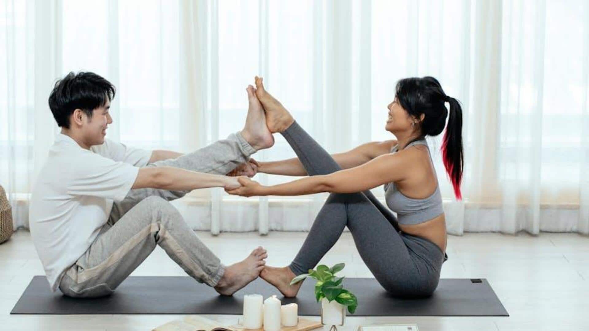 A Couple Doing Yoga Pose in Eye Shape · Free Stock Photo