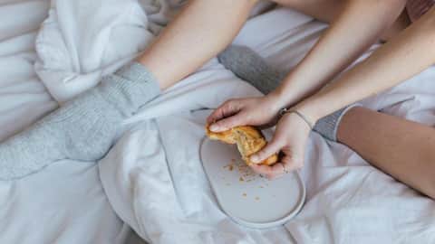 Why eating in bed might be a health hazard