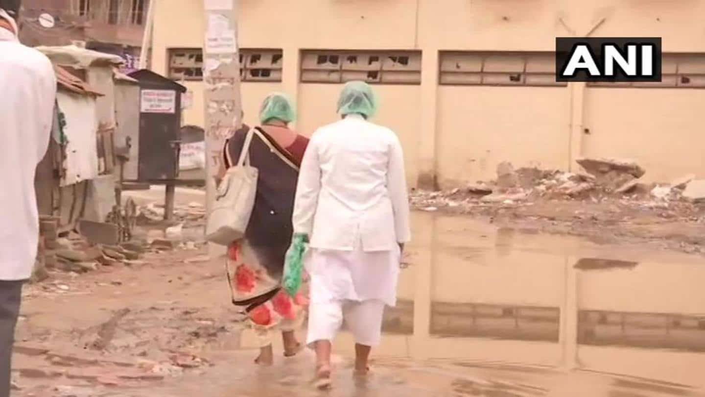 Nurses on emergency duty have to cross dirty water pools Nurses on emergency duty have to cross dirty water pools